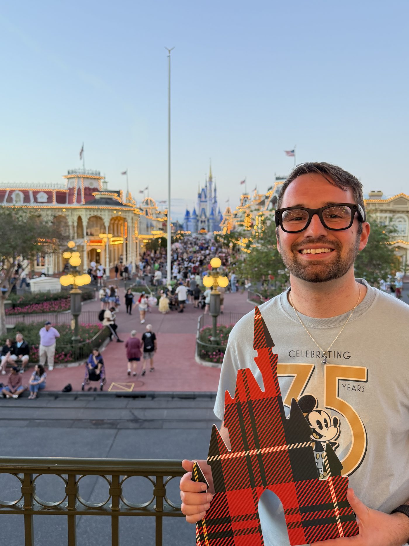 Cam smiling on Main Street with Cinderella Castle in the background