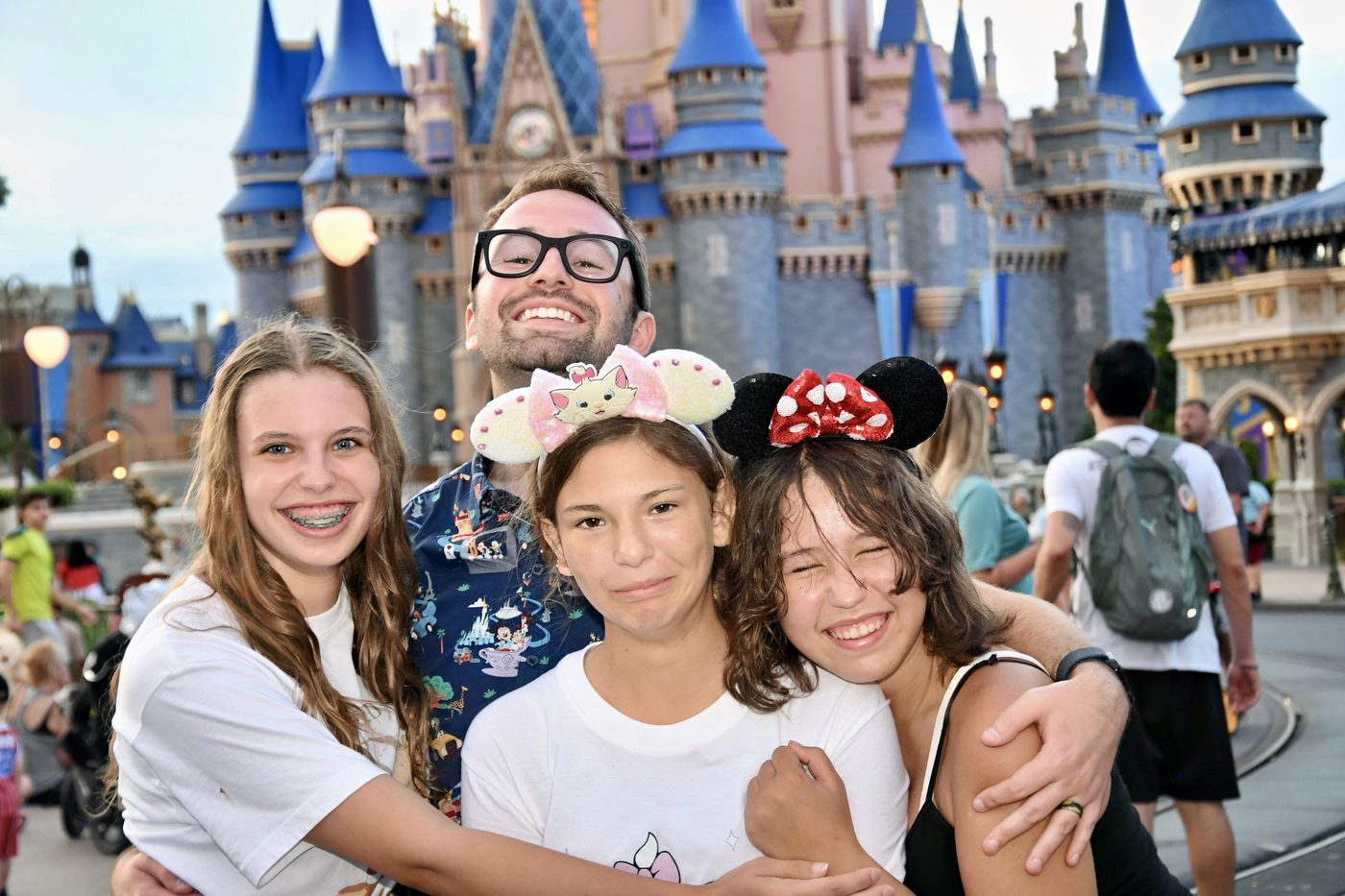 Cam with family in front of Cinderella Castle